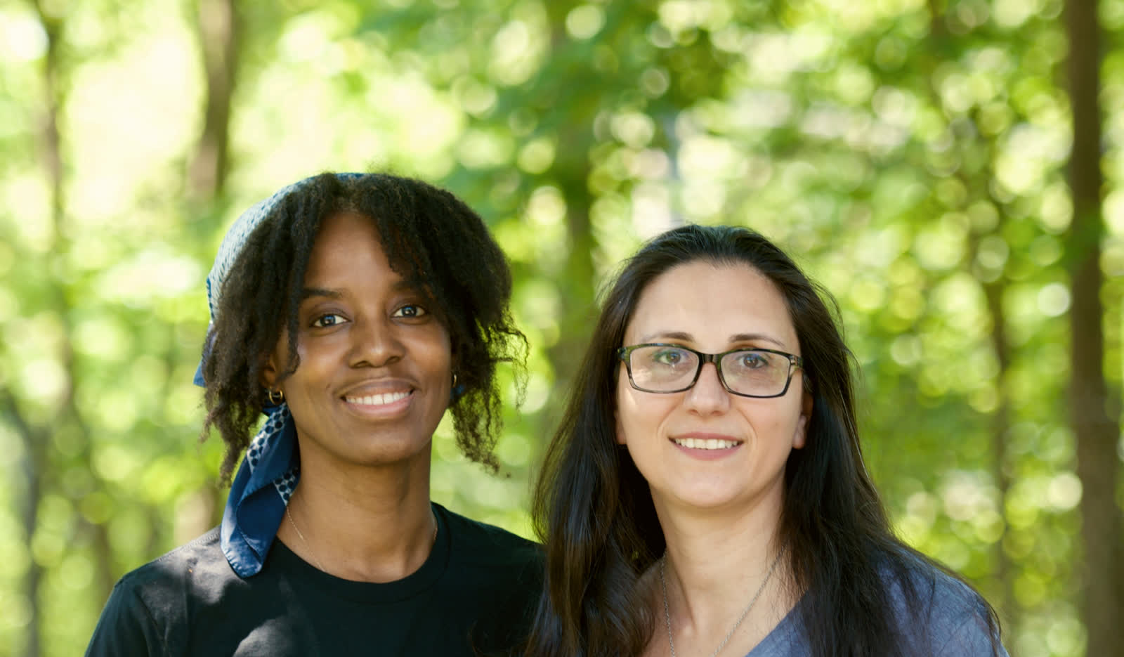Marsha Hemmings and Effie Makary, the founders of Catharsis Mobile Wellness, outdoors among trees